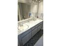 Functional bathroom featuring double sinks, ample counter space, and neutral finishes at 2912 Pathview Ln, Marietta, GA 30062