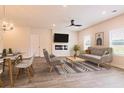 Bright living and dining room with contemporary furnishings and stylish decor at 1595 Sungrown Way, Mcdonough, GA 30253