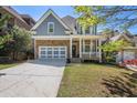 Traditional two-story home boasts stone and siding, attached two-car garage, and lovely manicured front lawn at 1159 Thornwell Ne Dr, Brookhaven, GA 30319