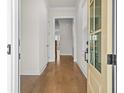 Bright foyer featuring hardwood floors, neutral walls, and a view into the main living spaces at 625 Skytop Dr, Cumming, GA 30040