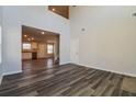 Spacious living area with an open layout, hardwood flooring, and views leading to the kitchen and dining areas at 108 Wheelers Dr, Dallas, GA 30157
