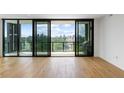 Balcony view featuring the city skyline, green treetops, and a built in gas grill at 2425 Peachtree Ne Rd # 1409, Atlanta, GA 30305