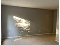 Inviting living room with neutral carpet and large window allowing for natural light at 2704 Cumberland Se Ct # 27, Smyrna, GA 30080