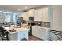 Eat-in kitchen features quartz countertops and stainless steel appliances at 1297 Ascot Ter, Atlanta, GA 30329