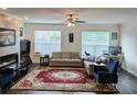 Inviting living room offers plenty of natural light and a cozy fireplace at 1297 Ascot Ter, Atlanta, GA 30329