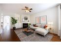 Cozy living room with fireplace, ceiling fan and large windows for natural light at 2361 Maplewood Ct # 25, Atlanta, GA 30339