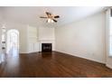 Inviting living room with built-in shelving, fireplace, and hardwood floors throughout at 2361 Maplewood Ct # 25, Atlanta, GA 30339