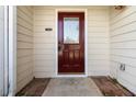 Elegant front door with glass detailing, offering a warm welcome and enhancing the home's entry appeal at 2470 Suwanee Lakes Trl, Suwanee, GA 30024