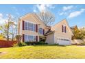 Attractive home with two-car garage, landscaped front yard, and inviting entrance, perfect for Gathering living at 2470 Suwanee Lakes Trl, Suwanee, GA 30024