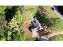 Aerial view of a single story home surrounded by mature trees on a large lot at 260 Eastwood Forest, Covington, GA 30014
