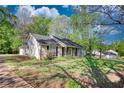Charming single story home with a traditional facade, covered front porch and beautiful yard at 260 Eastwood Forest, Covington, GA 30014