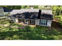 Traditional single story home with a covered front porch, shutters and beautiful lawn at 260 Eastwood Forest, Covington, GA 30014