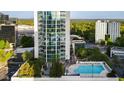 High-rise condo building featuring an outdoor pool and an exterior view of the unit highlighted at 3324 Peachtree Ne Rd # 1518, Atlanta, GA 30326