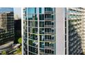 Exterior view of high-rise condo building with unit highlighted, showcasing modern architecture and glass windows at 3324 Peachtree Ne Rd # 1518, Atlanta, GA 30326