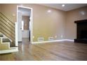 The spacious living room has wood floors, neutral walls and a fireplace at 3867 Cherie Glen Rd, Snellville, GA 30039