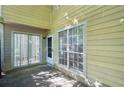 Cozy patio with sliding glass doors and natural lighting at 1066 Rock Creek Ln, Norcross, GA 30093