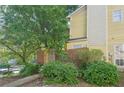 Charming exterior view with mature trees and manicured landscaping at 1066 Rock Creek Ln, Norcross, GA 30093