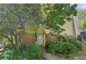 Inviting home exterior with mature trees and lush greenery in the front yard at 1066 Rock Creek Ln, Norcross, GA 30093