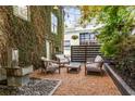 Charming outdoor patio area with stylish seating and a relaxing water feature at 1570 Dekalb Ne Ave # F, Atlanta, GA 30307