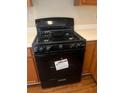 Close up of black, four-burner, Hotpoint stove at 2127 Manhattan Pkwy, Decatur, GA 30035