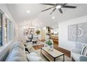 Bright open concept living room with modern decor, dining area, and bar seating at 2541 Peyton Woods Sw Trl, Atlanta, GA 30311