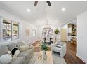 Sunlit living room showcasing hardwood floors, vaulted ceilings, and modern furnishings at 2541 Peyton Woods Sw Trl, Atlanta, GA 30311