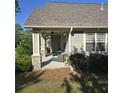 Covered patio with comfortable seating, perfect for relaxing outdoors at 278 Mission Oak Se Dr, Grayson, GA 30017