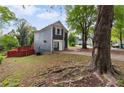 View of a two-story home featuring a well-maintained yard and a side entry garage at 1647 Imperial Ct, Norcross, GA 30093