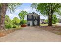 Charming two-story home featuring a well-maintained yard and inviting curb appeal on a sunny day at 1647 Imperial Ct, Norcross, GA 30093