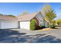 Single-Gathering home displaying a large driveway, two-car garage, and well-manicured front yard at 3858 Vineyards Lake Nw Cir # U-19, Kennesaw, GA 30144