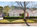 Well-maintained exterior with neat landscaping, decorative windows, and a charming brick accent, great curb appeal at 3858 Vineyards Lake Nw Cir # U-19, Kennesaw, GA 30144