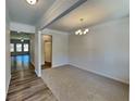 Inviting dining room with a chandelier and wood-look flooring, perfect for Gathering gatherings at 156 Crescent Wooode Dr, Dallas, GA 30157