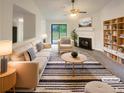 Bright living room featuring modern furniture, fireplace, and access to outdoor area at 2424 Turtle Xing Ne, Marietta, GA 30066