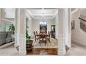 Elegant dining room features tray ceiling, hardwood floors, and classic furnishings perfect for entertaining guests at 609 Eskimo Ct, Cts, Hampton, GA 30228