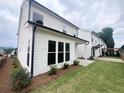 Spacious backyard with a well-manicured lawn and privacy fence at 683 Summitt Hill Way, Cumming, GA 30040