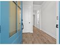Inviting entryway with wood-look flooring, showcasing bright, neutral walls and natural light at 683 Summitt Hill Way, Cumming, GA 30040