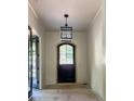 Elegant entryway featuring a pendant light and arched door with sidelights and transom at 2461 Fernleaf Nw Ct, Atlanta, GA 30318