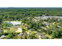 Aerial view of a home with a well-kept yard and close to wooded area with mountain views at 1081 Singleton Valley Cir, Norcross, GA 30093