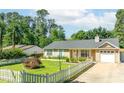 A well-maintained single-Gathering home with a classic design and neatly landscaped front yard at 1081 Singleton Valley Cir, Norcross, GA 30093