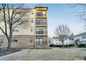Attractive multi-story condo building featuring stone accents and balconies at 2230 Cheshire Bridge Rd # 412, Atlanta, GA 30324