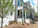 Beautiful light brick two story home features a welcoming front porch and black wrought iron fencing at 1059 Dryden Ln # 11, Atlanta, GA 30319