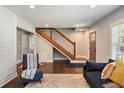 Inviting living room with hardwood floors, staircase and modern decor at 1535 Deerwood Dr, Decatur, GA 30030