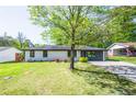 Beautifully landscaped front yard with a classic home design and lush greenery at 3719 Paul St, Douglasville, GA 30135