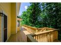 Spacious wooden deck overlooking a lush backyard, perfect for outdoor entertaining and relaxation at 4503 Rivercliff Sw Dr, Lilburn, GA 30047