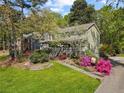 Attractive home boasting a welcoming entrance, a well-manicured lawn, and colorful azaleas at 5539 Hurstcliffe Nw Dr, Kennesaw, GA 30152