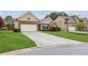 Charming single-Gathering home with a two-car garage, well-manicured lawn and beautiful landscaping at 4580 Orchard Ridge Ct, Cumming, GA 30028
