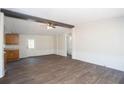 Open living room featuring modern flooring, neutral walls, and a ceiling fan at 56 Windom Dr, Carrollton, GA 30116