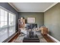 Office with hardwood floors, large windows, and a neutral paint color, perfect for working at home at 725 Martin Field Dr, Lawrenceville, GA 30045