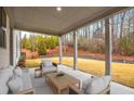 Inviting covered patio with comfortable seating, perfect for outdoor relaxation at 1010 Coleman Place Dr, Roswell, GA 30075
