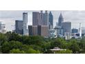 Stunning view of the Atlanta skyline from an elevated vantage point amidst lush greenery at 359 Skylar Se Ct, Atlanta, GA 30315